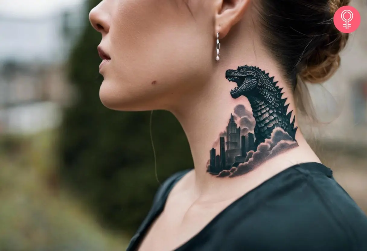 A Godzilla tattoo design on a woman’s neck