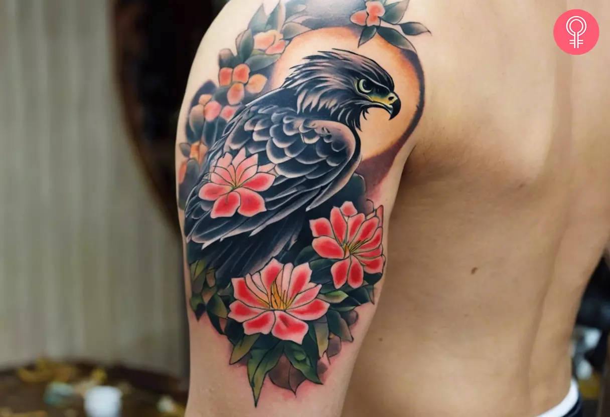 A Japanese hawk tattoo on the upper arm