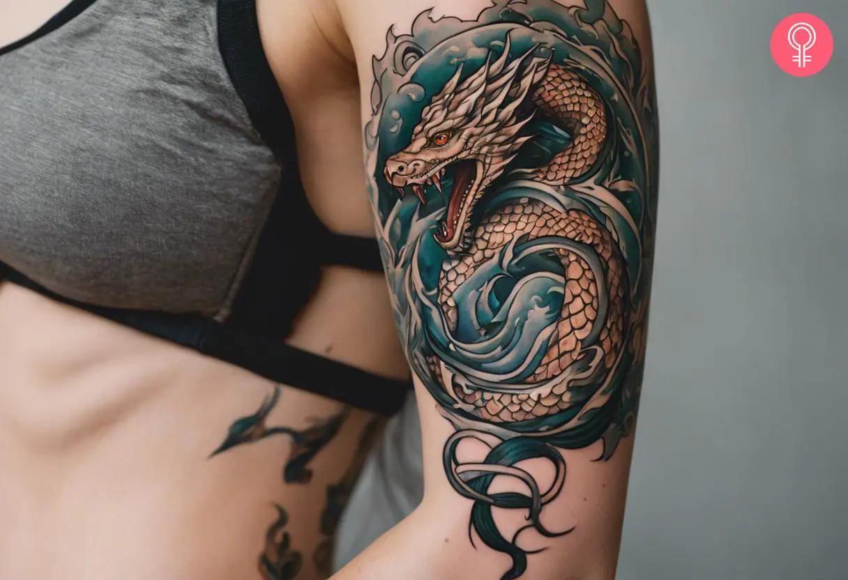 A Norse mythology Jormungandr tattoo on the upper arm