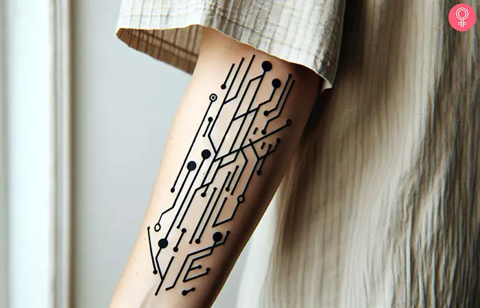 A computer circuit tattoo on the forearm