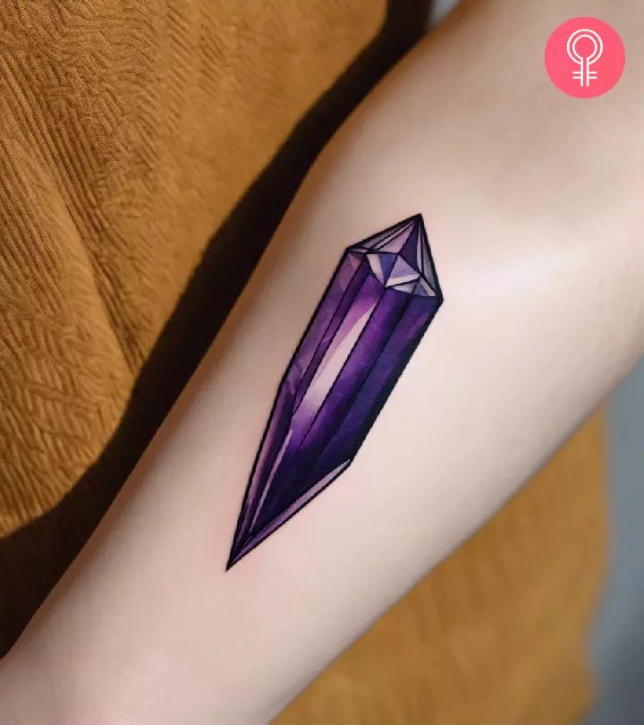 A crystal tattoo on the forearm