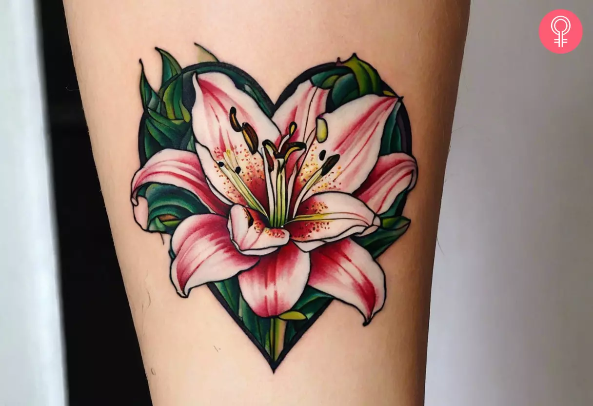 A floral heart tattoo on the forearm