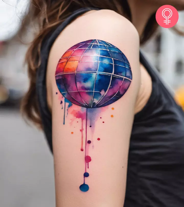 A forearm disco ball tattoo