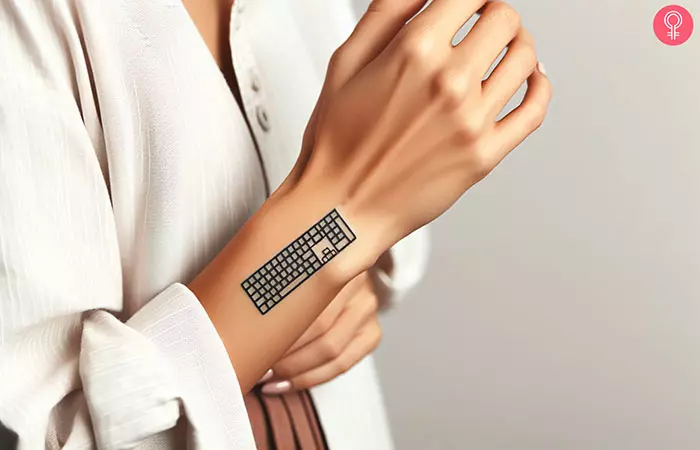 A keyboard tattoo on a woman’s wrist