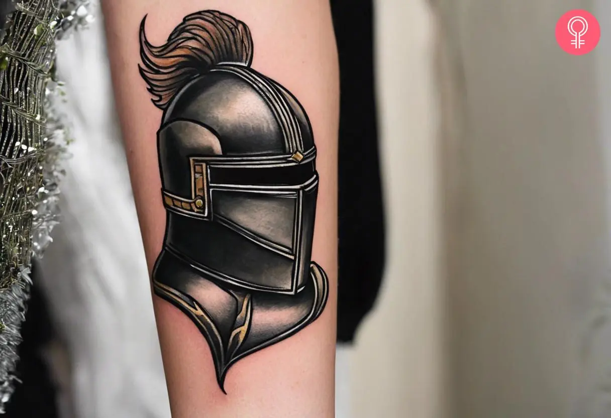 A knight helmet tattoo on a woman’s forearm