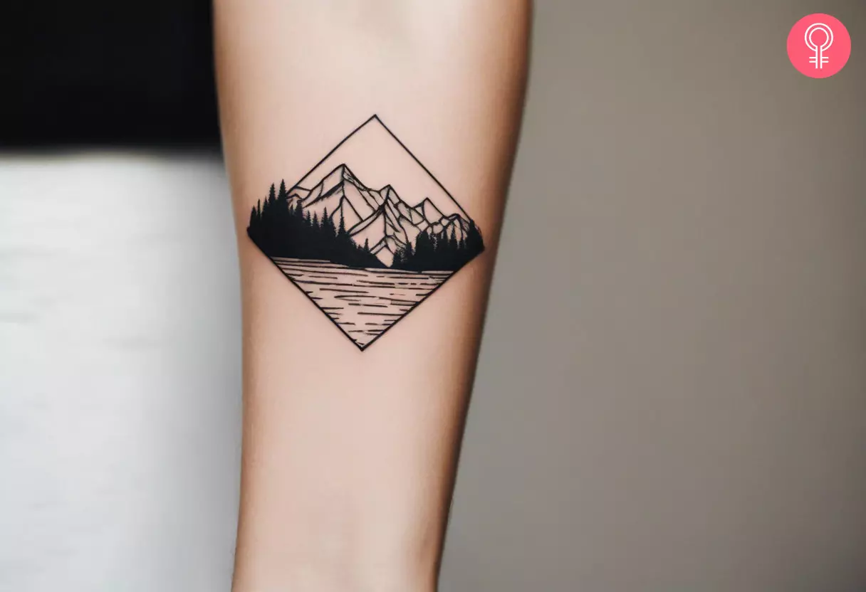 A line-art tattoo of a mountain on the forearm.