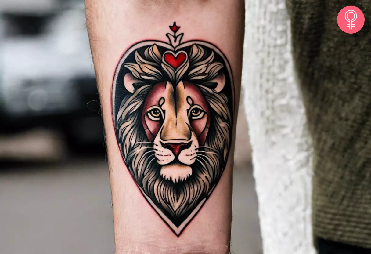 A lion and heart tattoo on the forearm