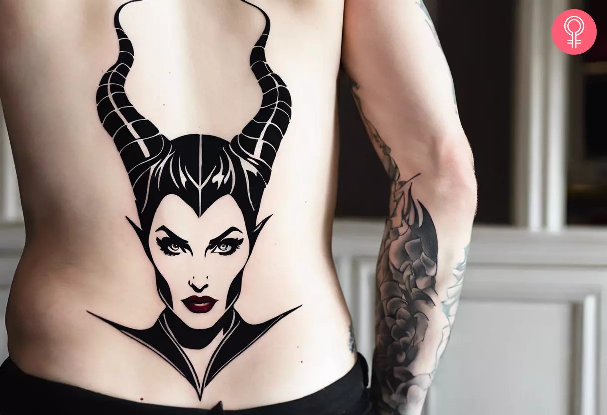 A man wearing a maleficent outline tattoo on the lower back