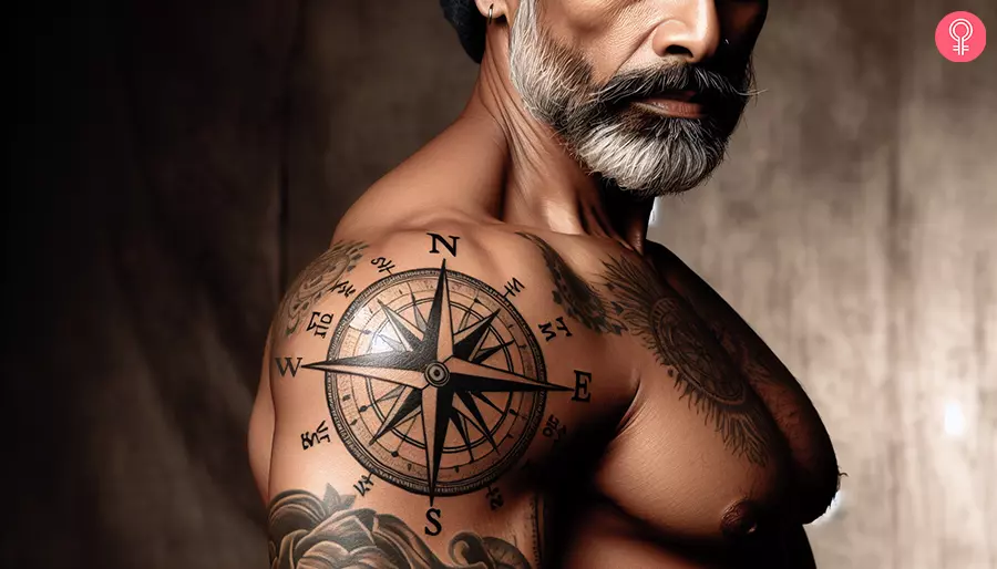 A man with a compass shoulder tattoo