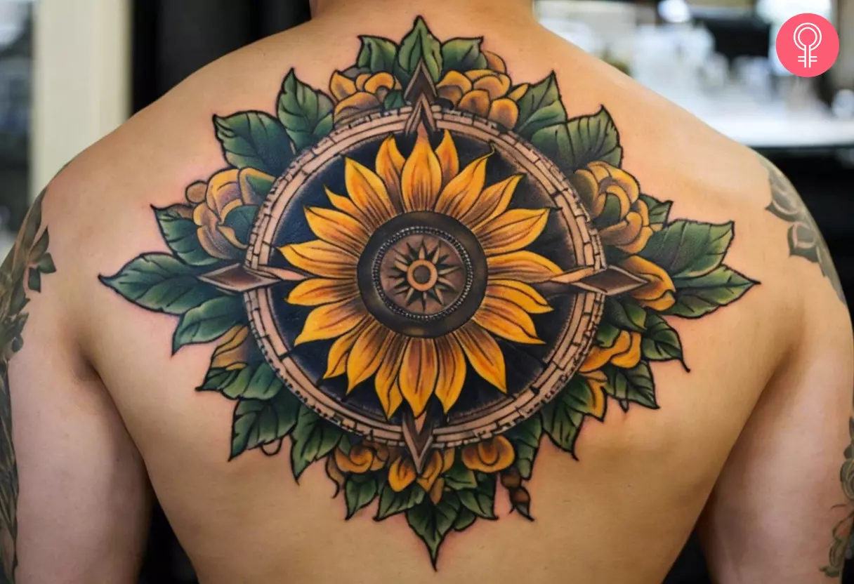 A man with a sunflower compass tattoo on the back