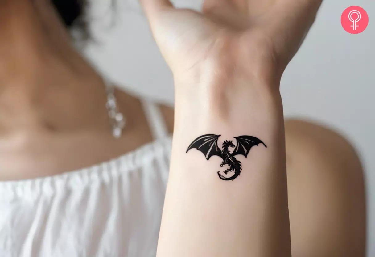 A micro dragon tattoo on the wrist