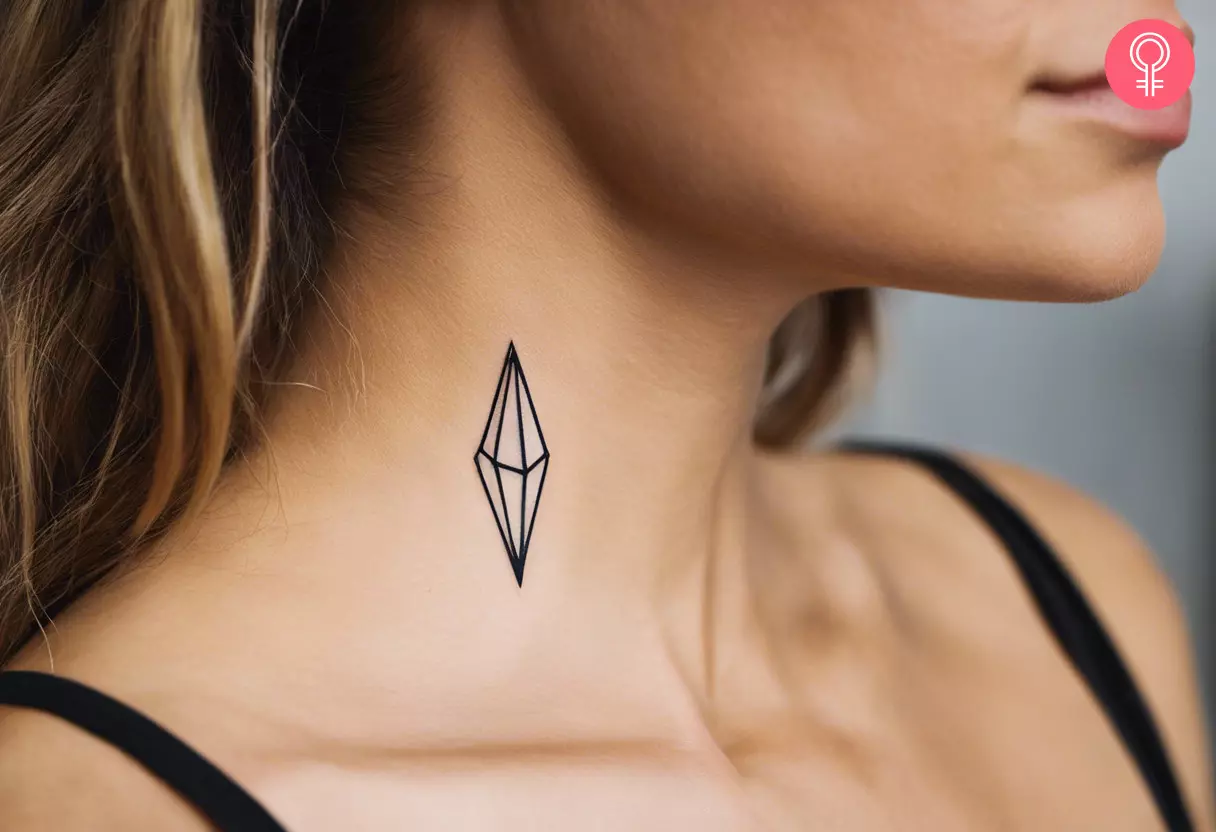 A minimalist crystal tattoo on the neck