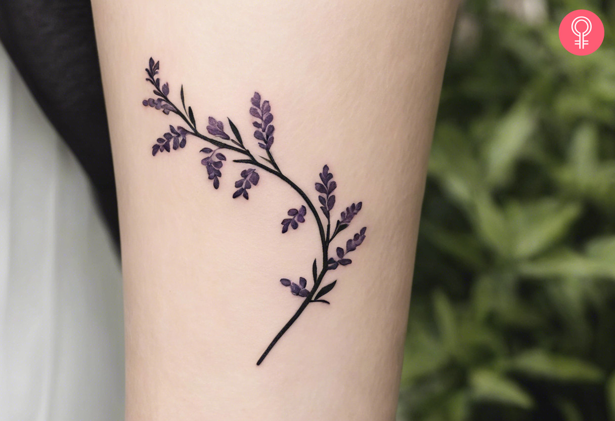 A minimalist wisteria vine tattoo on the arm of a woman