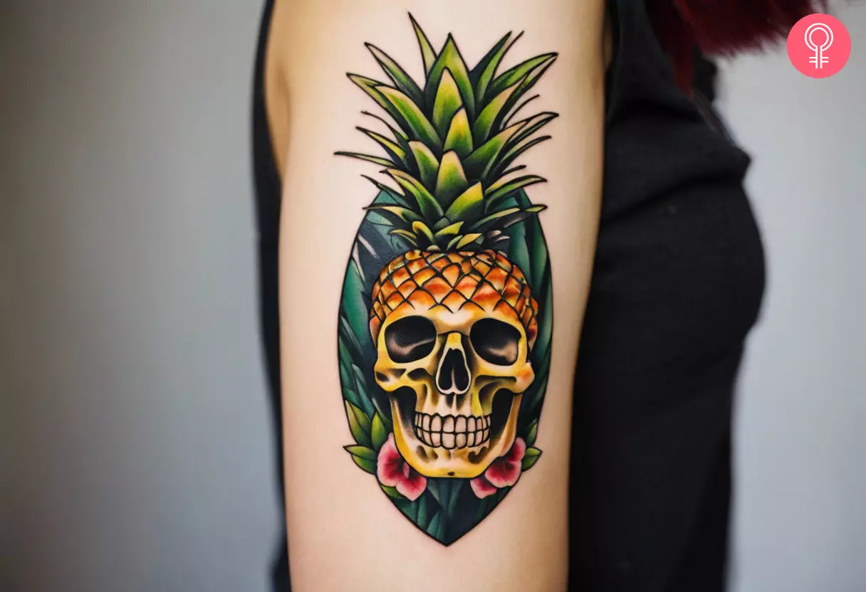 A pineapple skull tattoo on a woman's arm