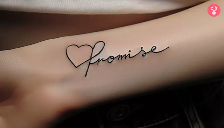 A tattoo with the word ‘promise’ inked on the forearm with a heart