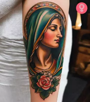 A tattoo of a woman’s portrait on the inner bicep