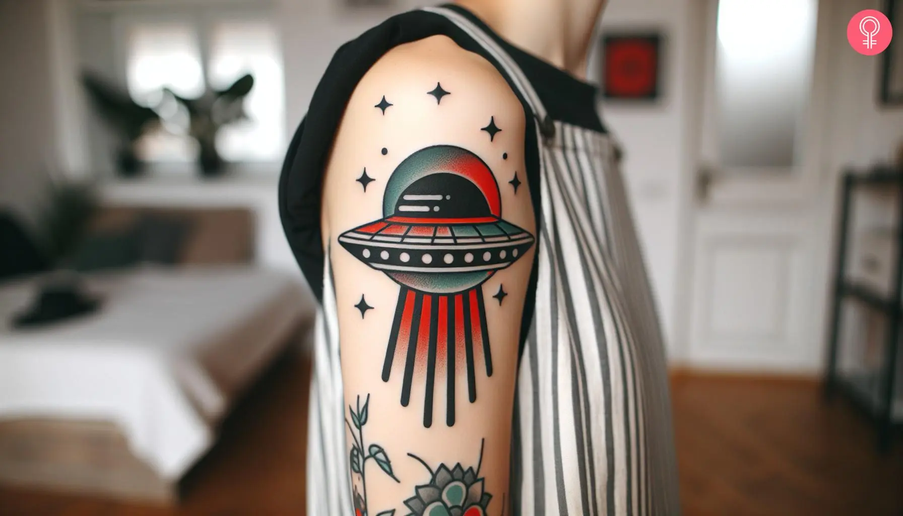 A traditional UFO tattoo on the upper arm