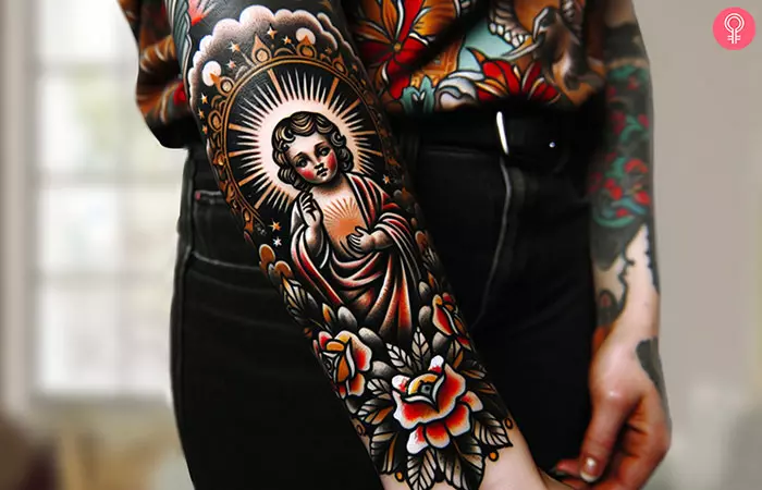 A traditional colored baby Jesus tattoo on the forearm