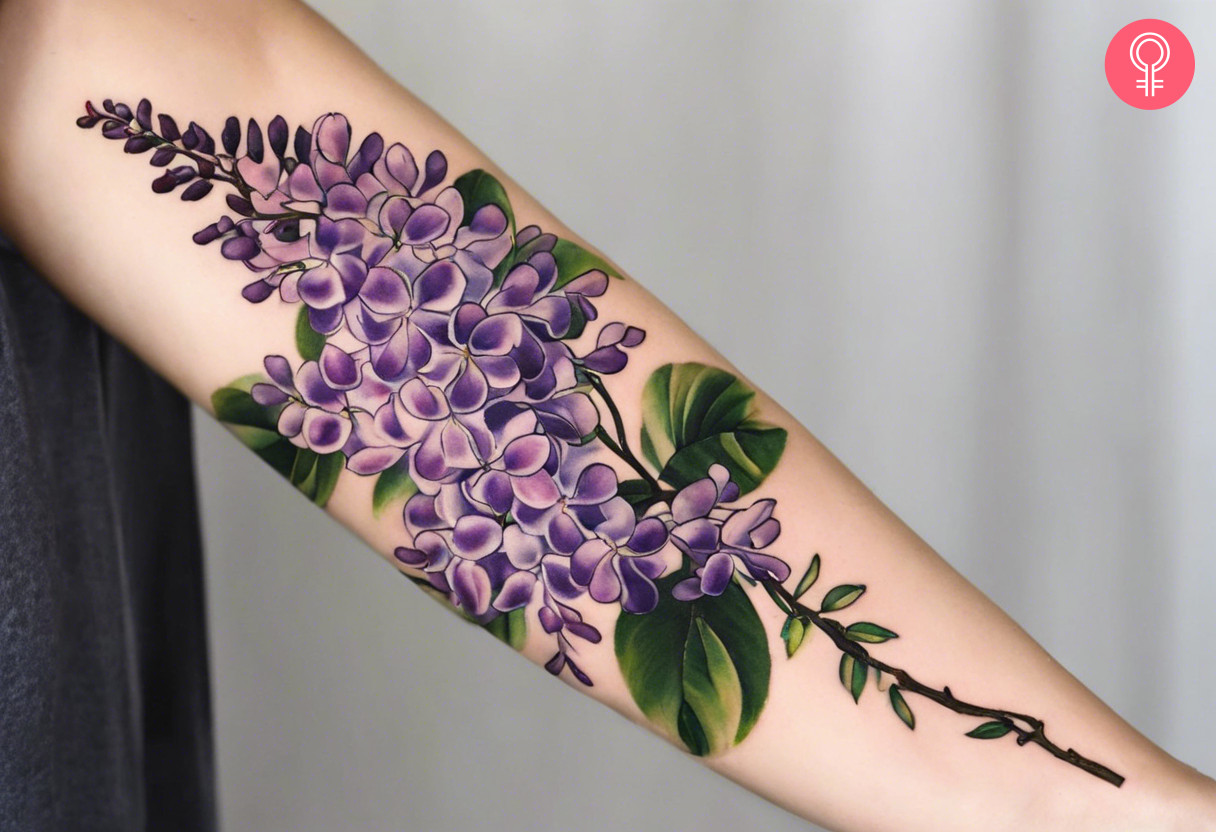 A wisteria vine tattoo on the sleeve of a woman