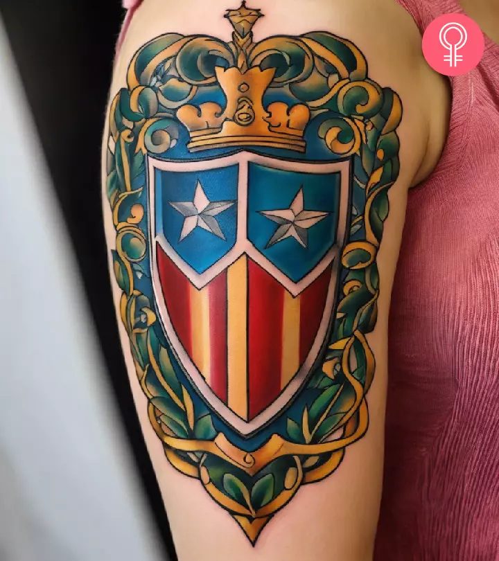 A woman flaunting a shield tattoo on the upper arm