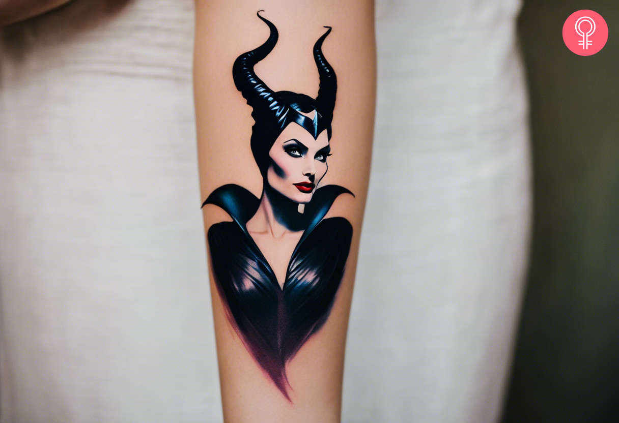 A woman wearing a Maleficent tattoo on her lower arm