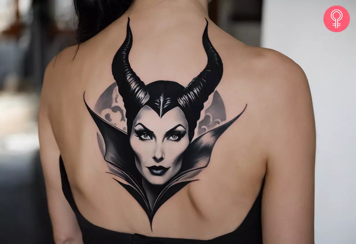 A woman wearing a black-and-white Maleficent tattoo on the back