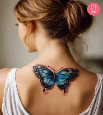 A woman with a monarch butterfly tattoo