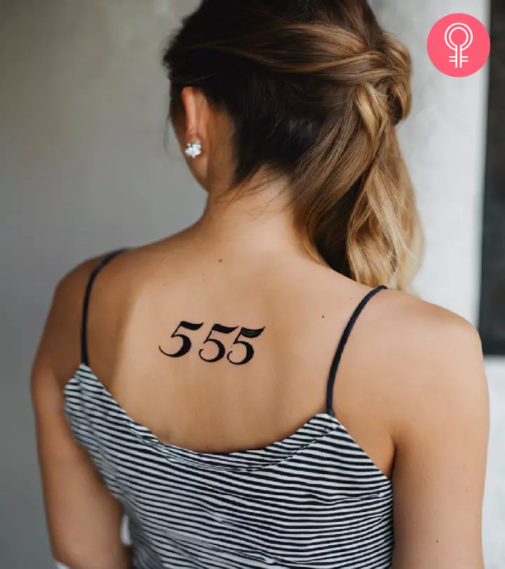 A woman with a 555 tattoo on her upper back