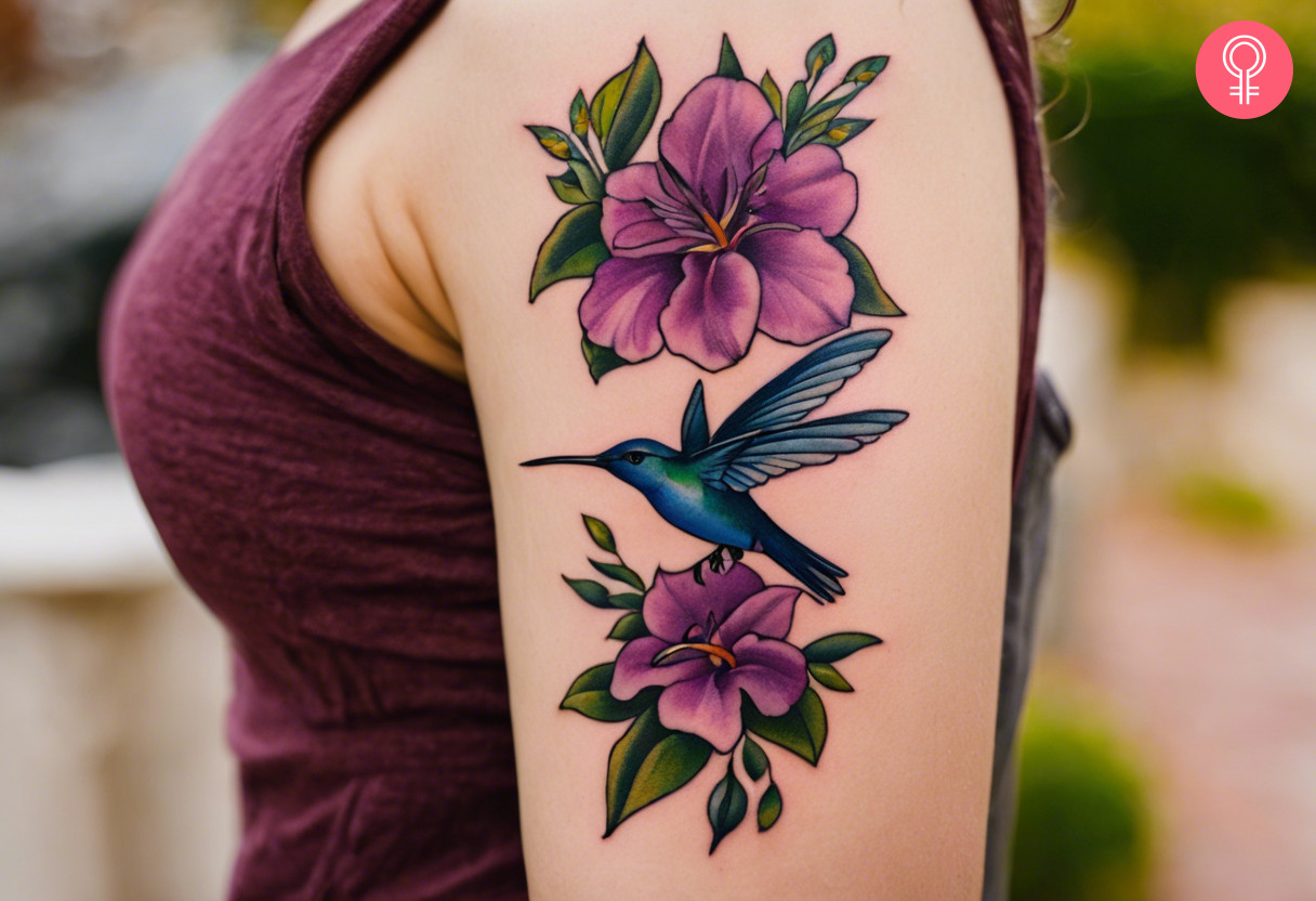 A woman with a colored larkspur tattoo on her upper arm