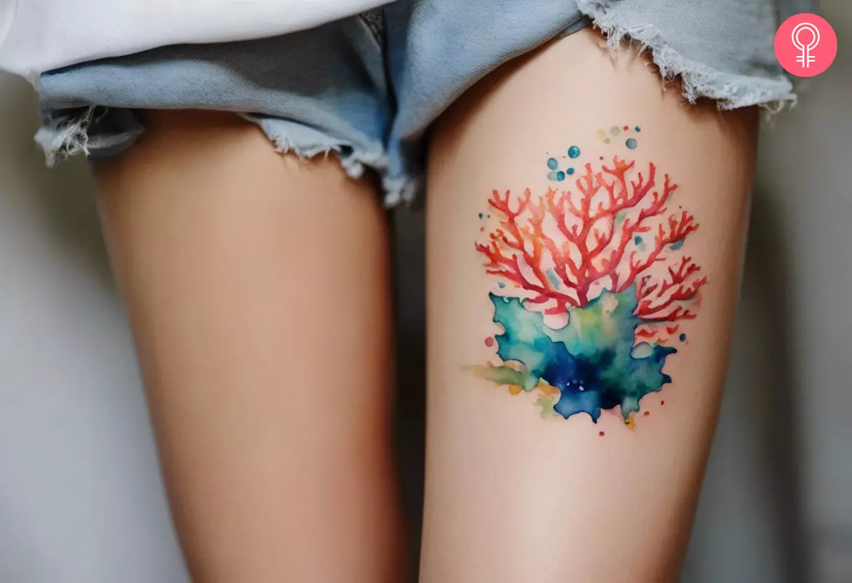 A woman with a coral reef tattoo on her thigh