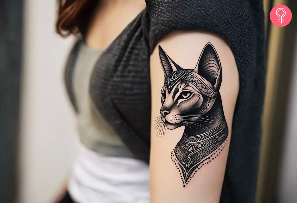 A woman with a dotwork Bastet tattoo