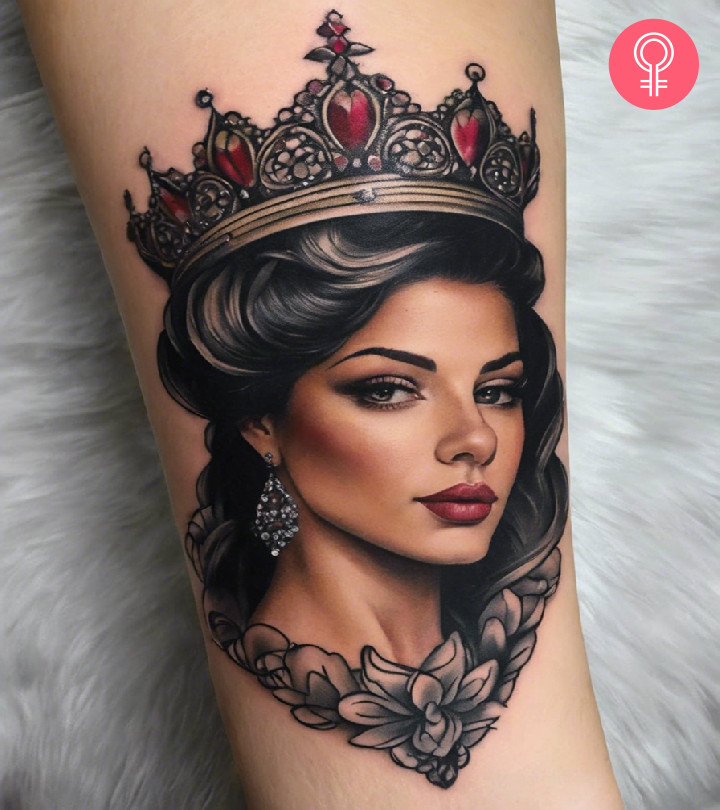 A woman with a queen tattoo on her forearm