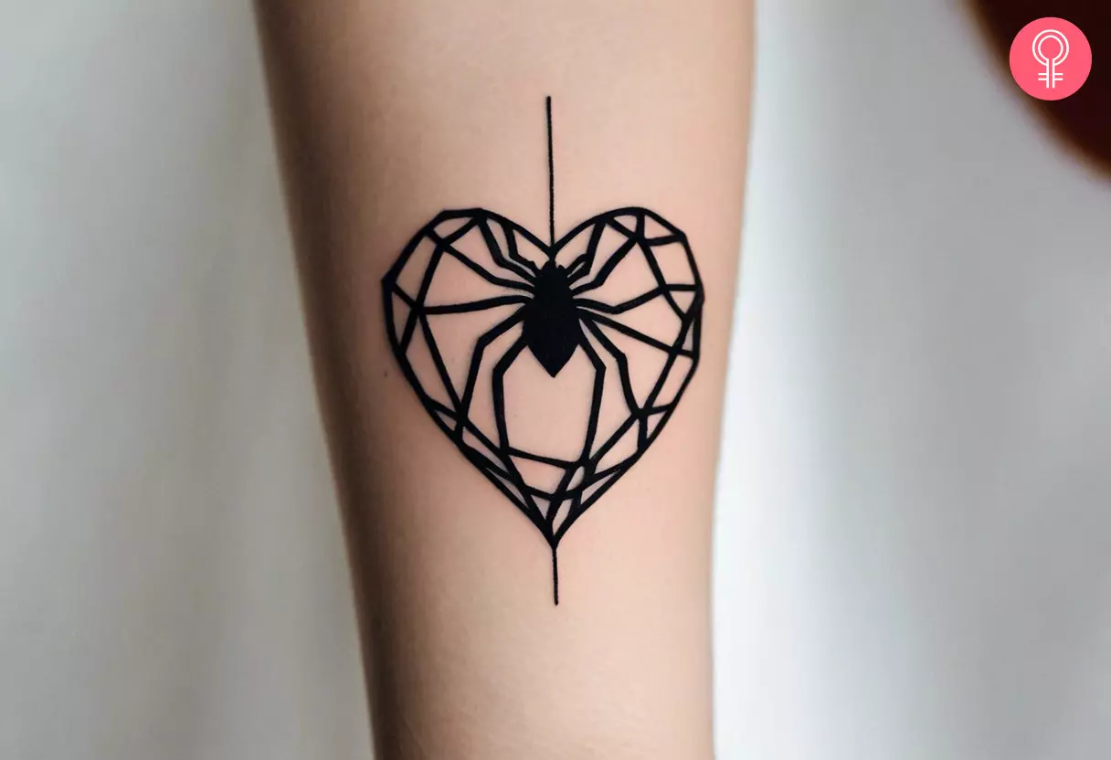 A woman with a spider and heart tattoo on her lower arm