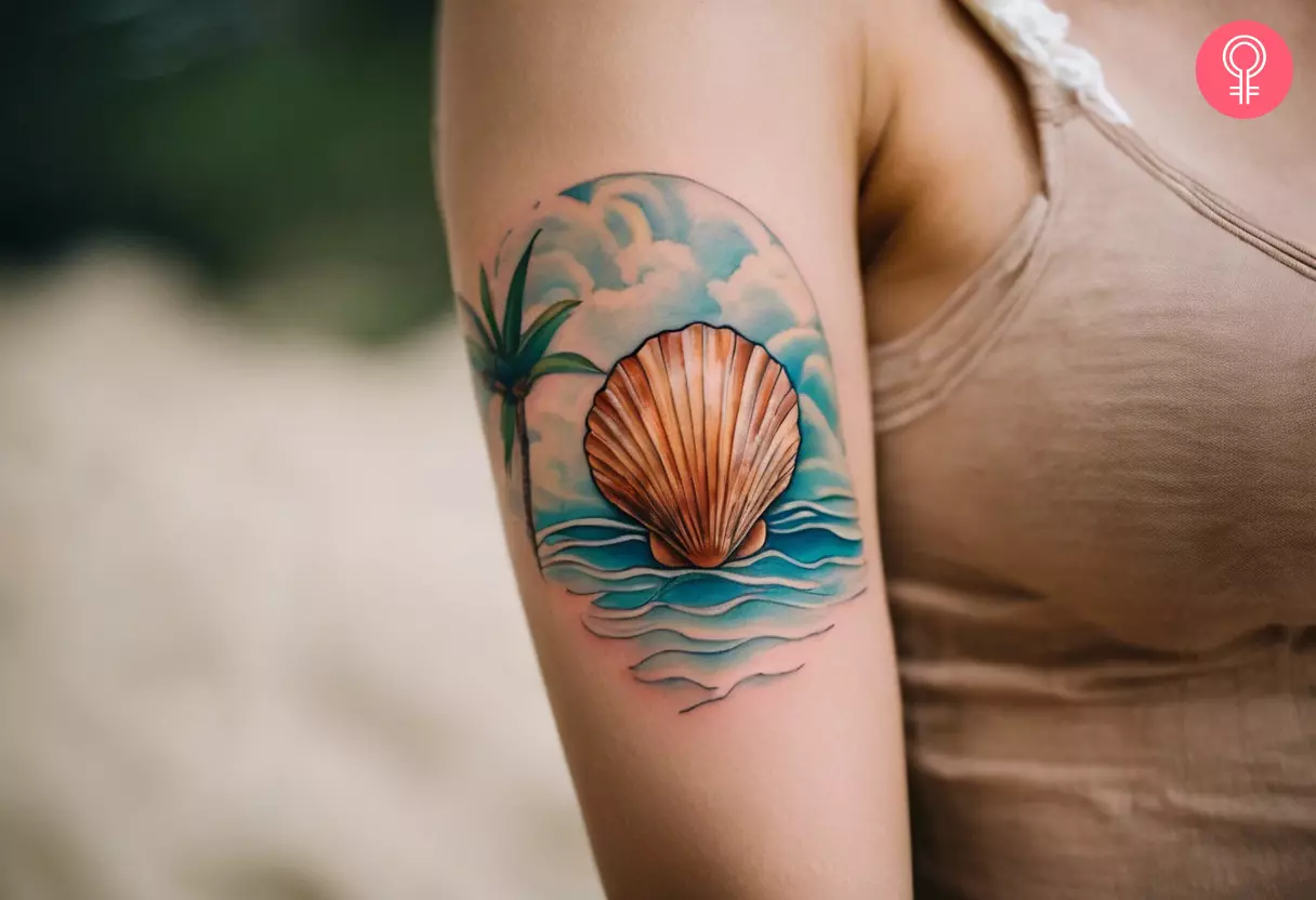 A woman with a vibrant, beach-themed seashell tattoo on her upper arm