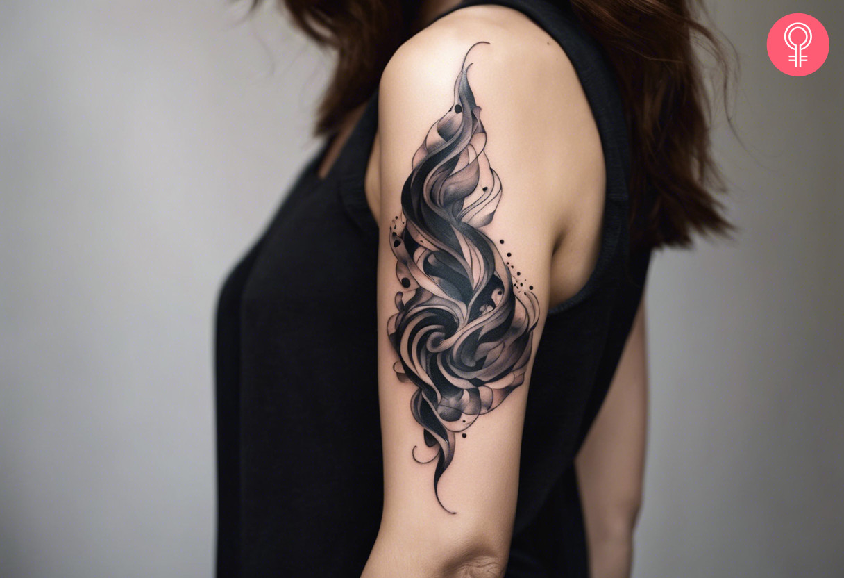 Abstract smoke tattoo on the arm of a woman