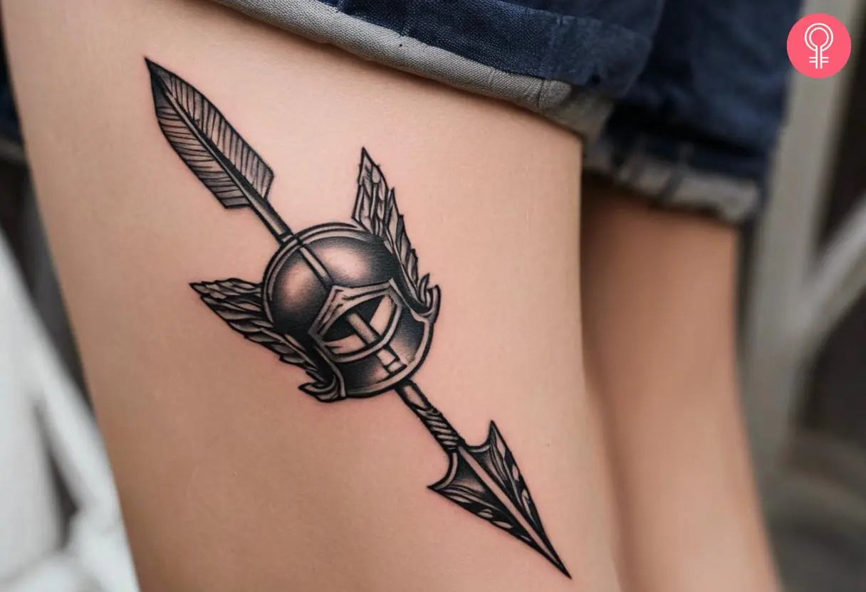 Achilles arrow tattoo on the back of the thigh