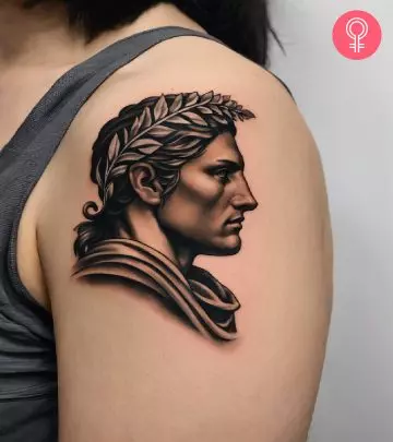 A woman with a Greek statue tattoo on the arm