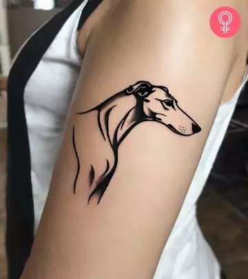 Woman with a fox tattoo on the forearm