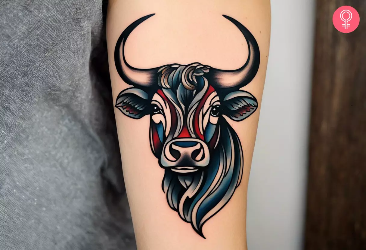 An American traditional bull tattoo on a woman’s arm