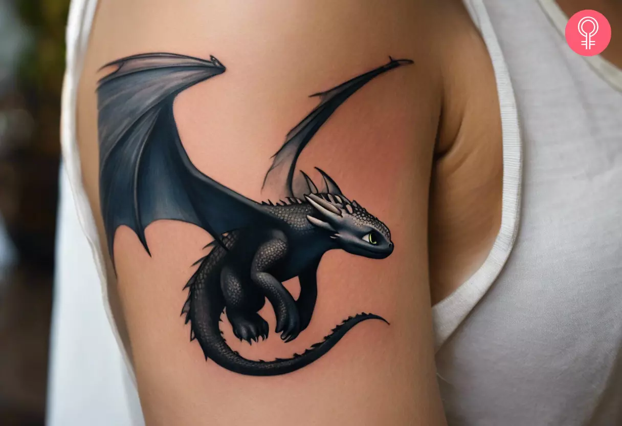 An illustrated tattoo of Toothless, the dragon