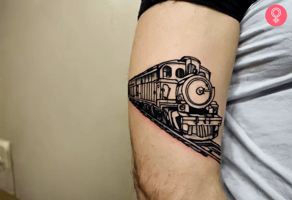 An outline train tattoo on the arm