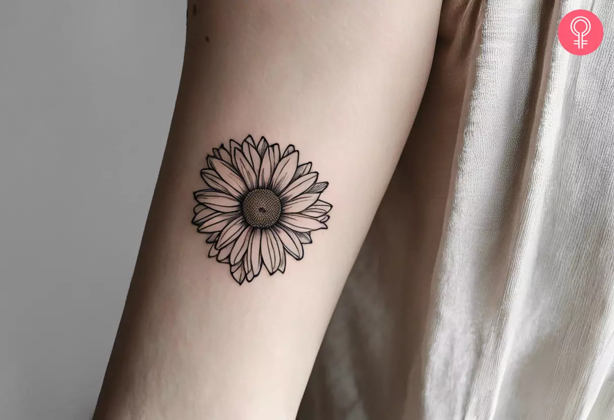 A back of arm tattoo of a flower