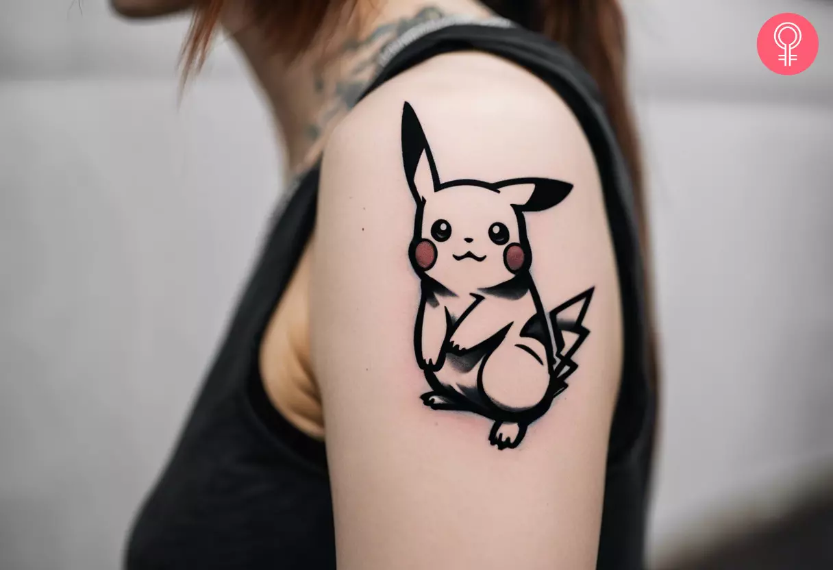 A woman with a black and white Pikachu tattoo on her upper arm