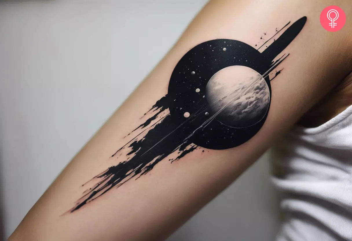 A woman with a black and white space tattoo on her arm