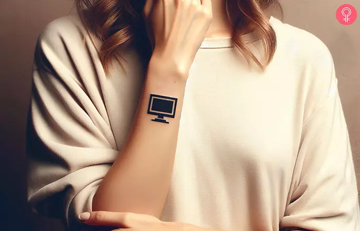 A minimalist computer tattoo on the hand