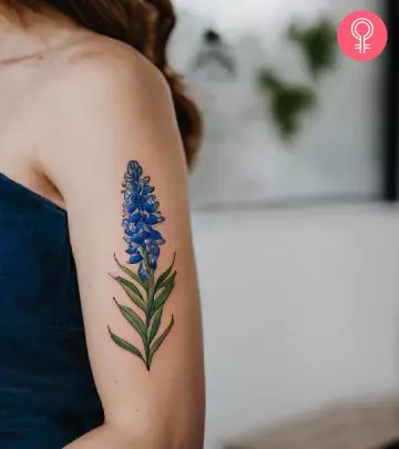 A woman with a landscape tattoo on her shoulder