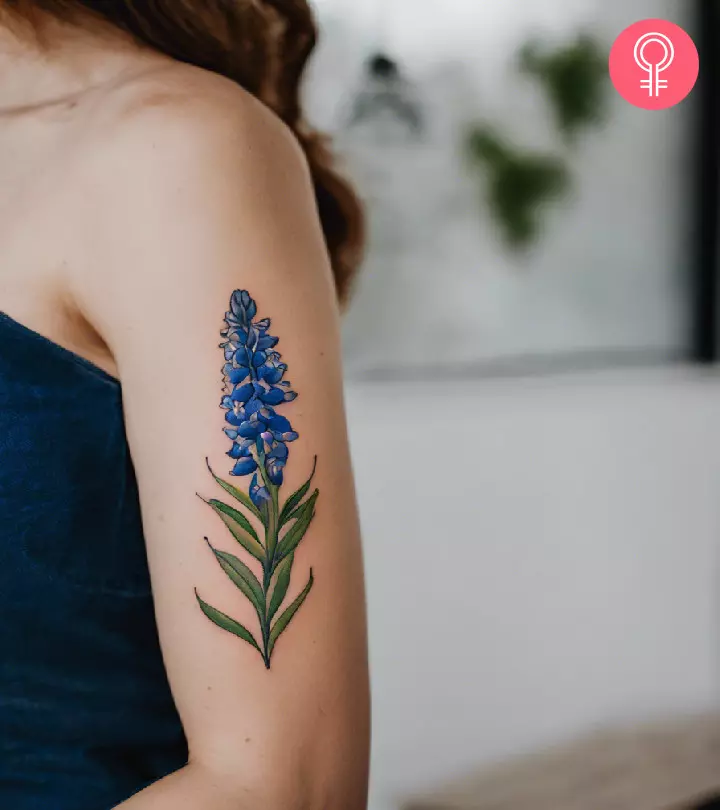 Bluebonnet tattoo design on the arm of a woman
