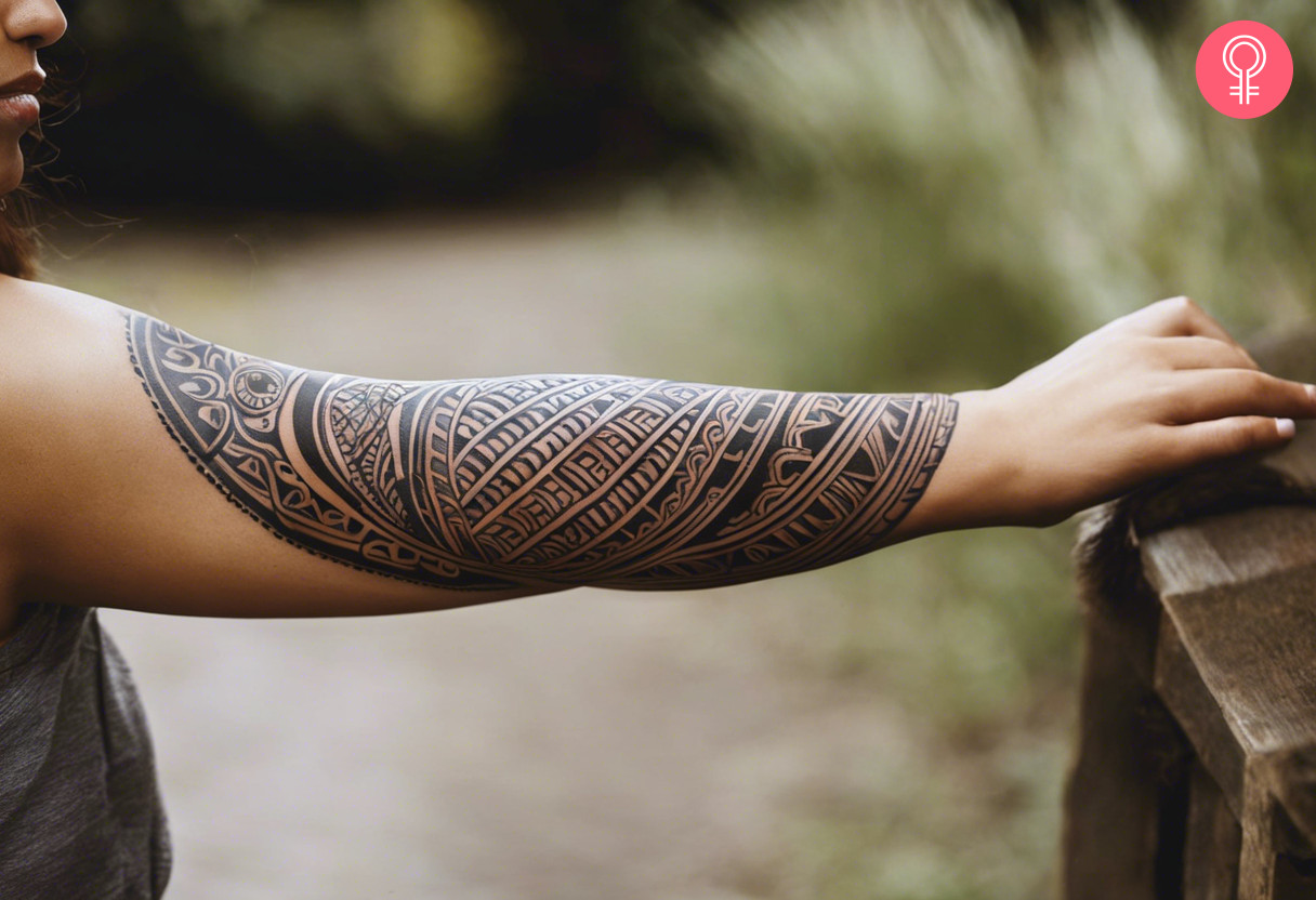 Circular maori sleeve tattoo on a woman