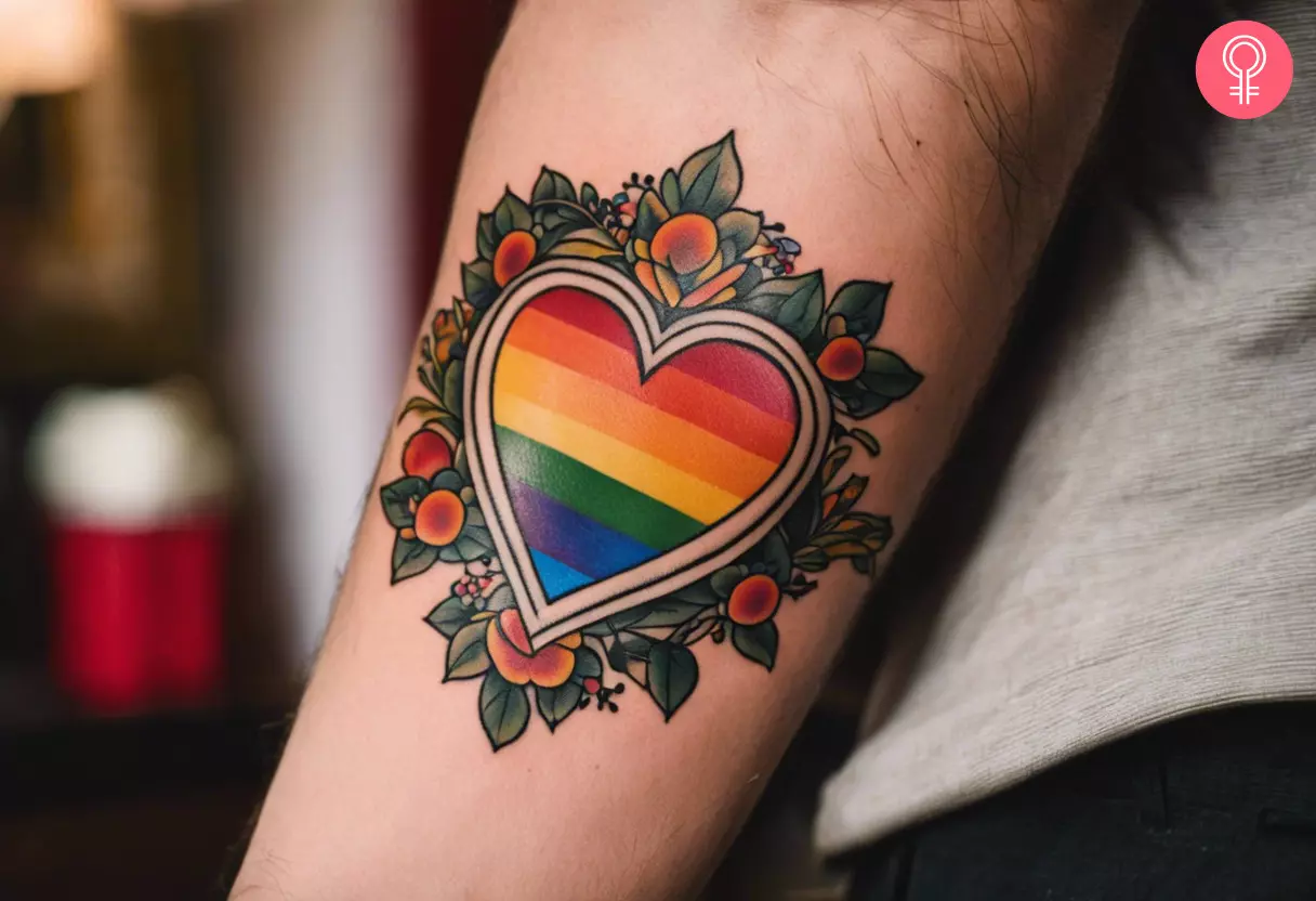 Colorful rainbow heart tattoo on the forearm