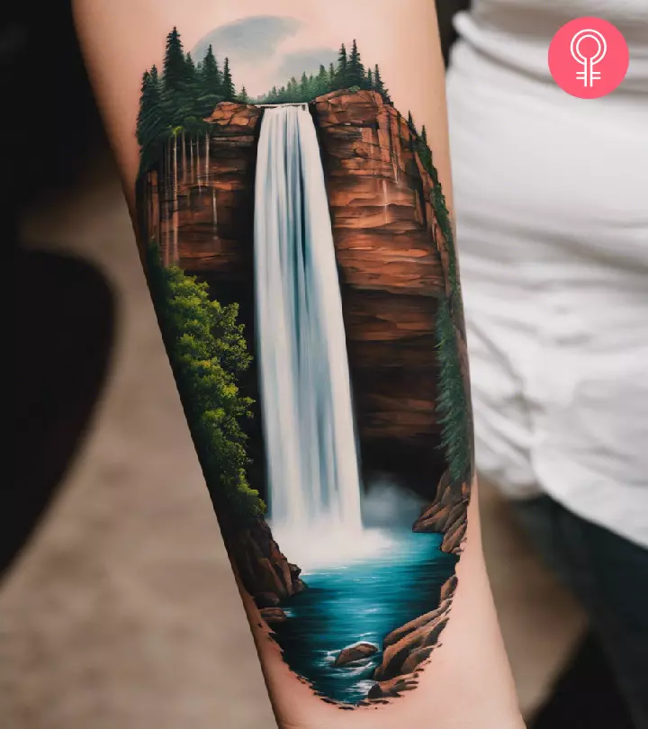 A waterfall tattoo design on the arm of a woman